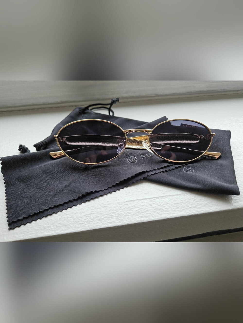 Gold Frame Oval Sunglasses with Dark Lenses